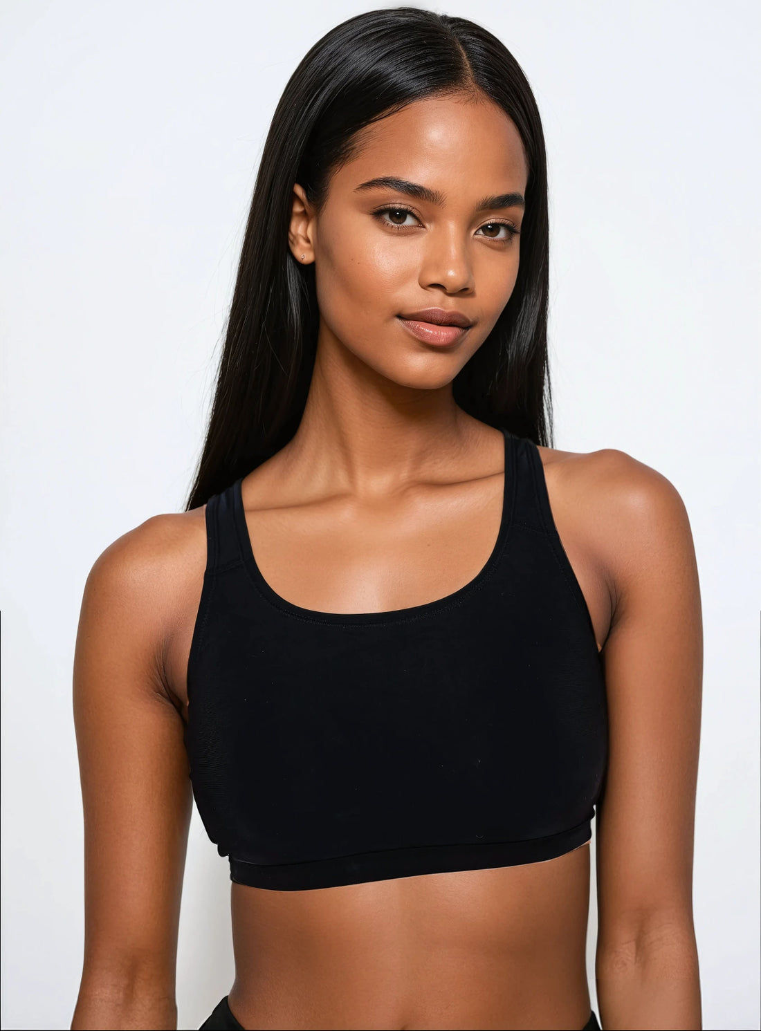 Woman wearing a blue floral bikini top on a white background