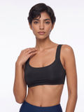 Sienna Swim Bra in black worn with navy swim bottoms on a model showcasing supportive size inclusive swimwear with a comfortable fit for every body