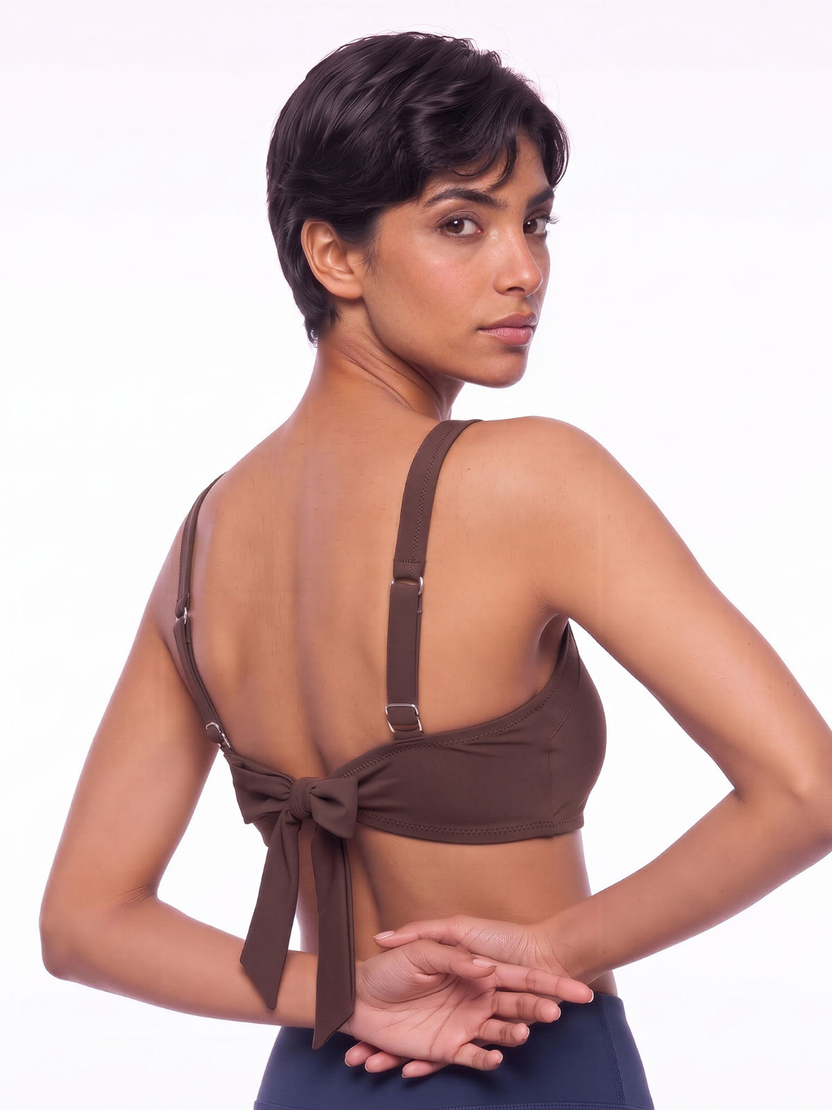 Sienna Swim Bra in brown shown from the back on a model with adjustable straps and a tie closure supportive comfortable size inclusive swimwear for every body