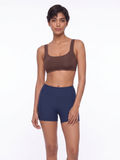 Sienna Swim Bra in brown with wide straps paired with navy swim shorts for supportive comfortable swimwear designed for every body