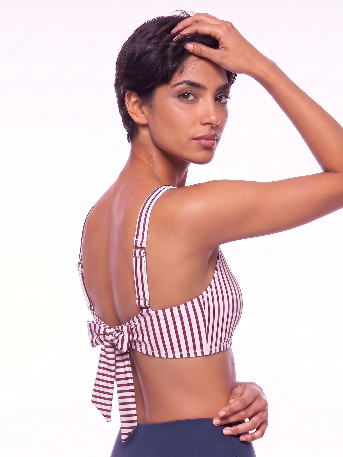 Sienna Swim Bra in red and white stripes shown from the back with adjustable straps and tie detail offering supportive modest coverage for every body