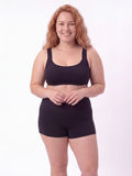 Sienna Swim Bra | Plus Size in black modeled with matching swim shorts, showing supportive, comfortable, size-inclusive modest swimwear designed for every body