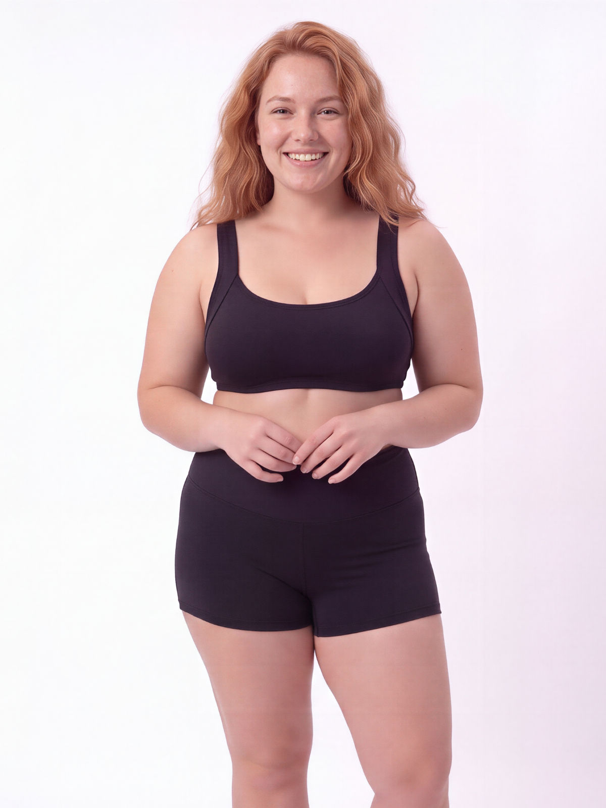 Sienna Swim Bra | Plus Size in black modeled with matching swim shorts, showing supportive, comfortable, size-inclusive modest swimwear designed for every body