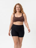 Sienna Swim Bra | Plus Size shown on a smiling woman with black swim shorts demonstrating size-inclusive modest swimwear with a supportive comfortable fit