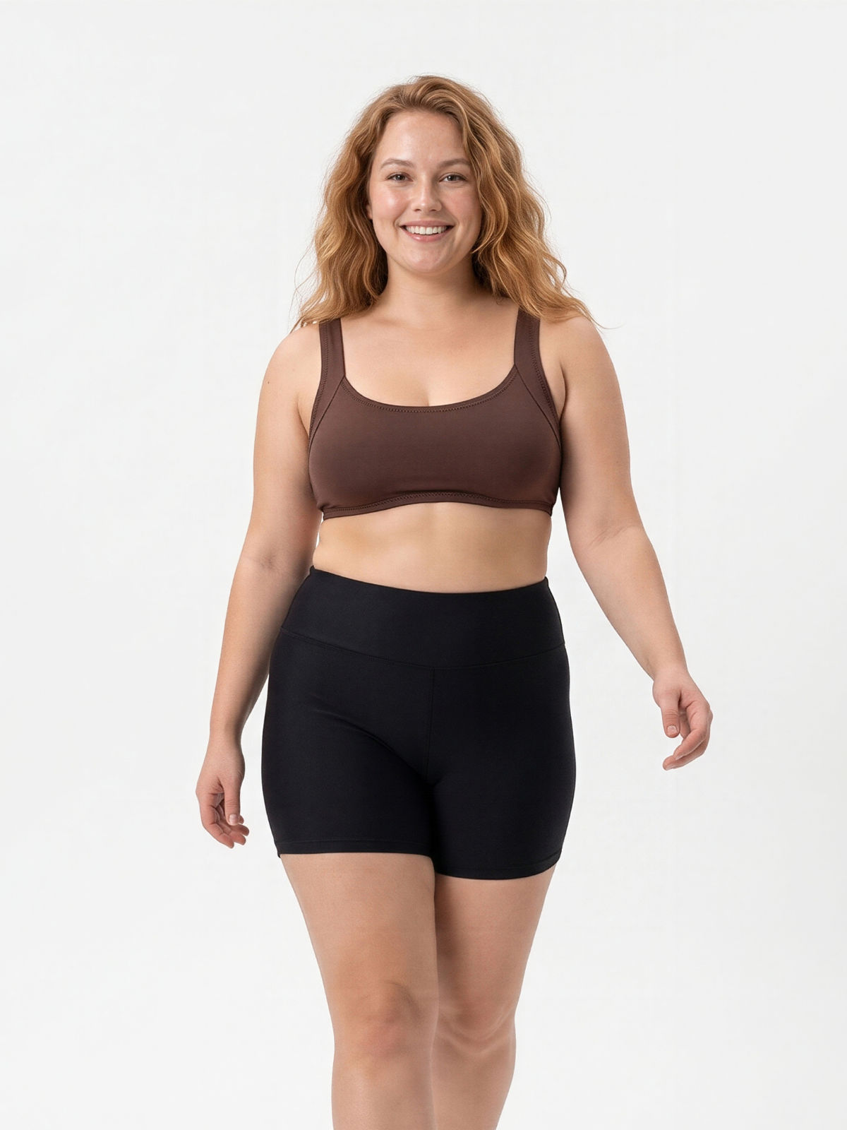 Sienna Swim Bra | Plus Size shown on a smiling woman with black swim shorts demonstrating size-inclusive modest swimwear with a supportive comfortable fit