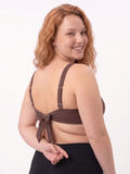 Sienna Swim Bra | Plus Size shown from the back on a smiling model with adjustable straps and a supportive fit for modest size inclusive swimwear