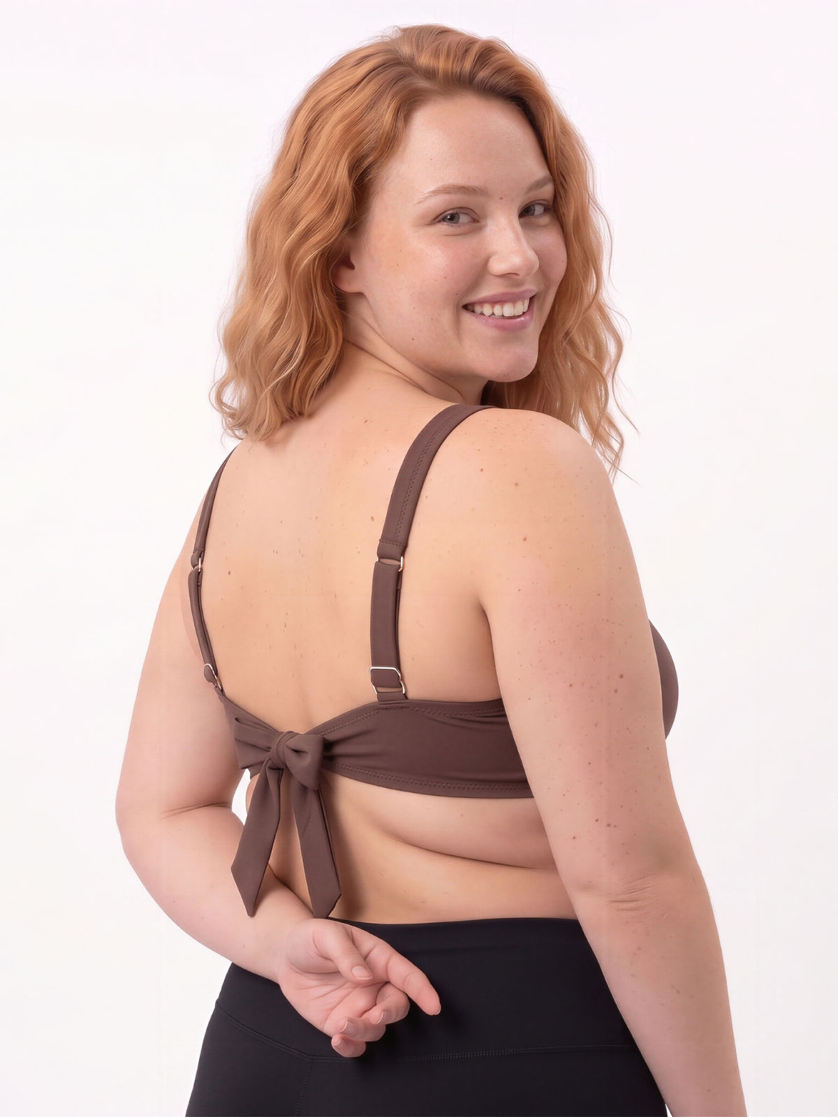 Sienna Swim Bra | Plus Size shown from the back on a smiling model with adjustable straps and a supportive fit for modest size inclusive swimwear