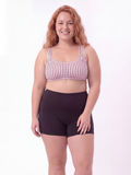 Sienna Swim Bra | Plus Size on a smiling model, featuring a striped supportive swim top with a comfortable fit, showcasing size-inclusive swimwear for every body.