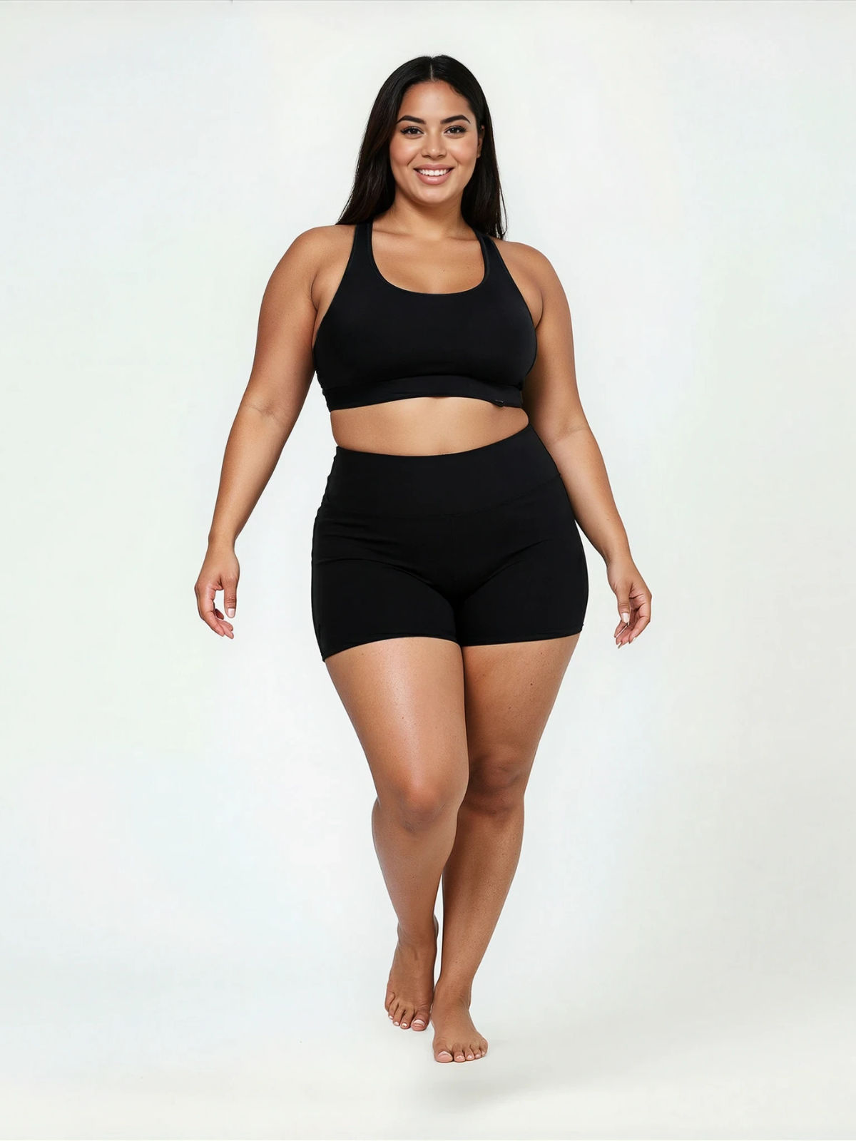 Swim Shorts | Plus Size shown on a smiling model in black swim shorts and a matching top for comfortable size inclusive swimwear designed for every body