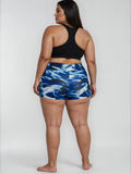 Swim Shorts | Plus Size in blue abstract print shown on a plus size model with a comfortable fit for modest size-inclusive swimwear designed for every body