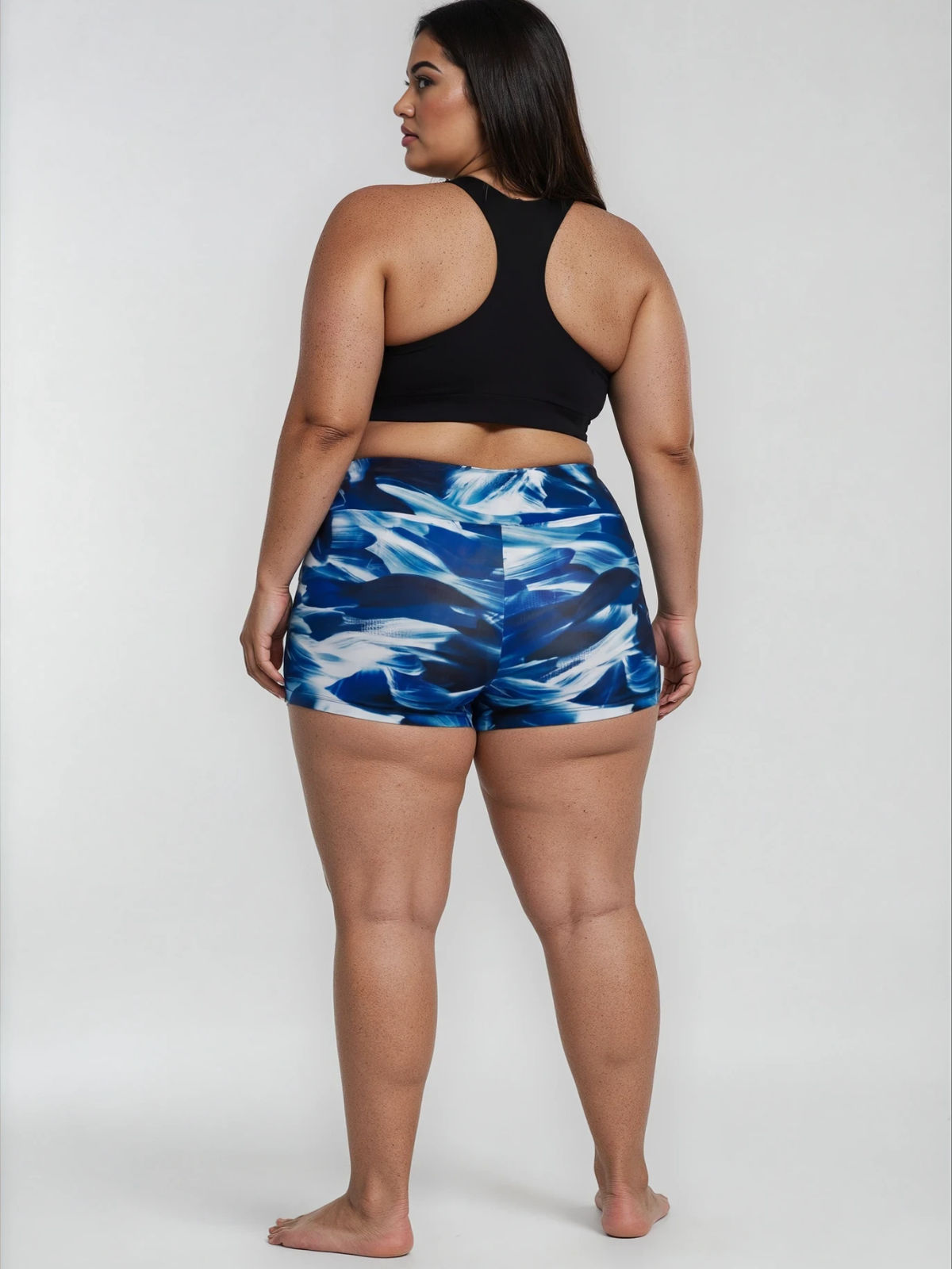 Swim Shorts | Plus Size in blue abstract print shown on a plus size model with a comfortable fit for modest size-inclusive swimwear designed for every body