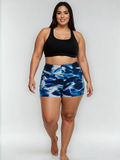 Swim Shorts | Plus Size in a blue abstract print with a comfortable fit on a plus size model. Size inclusive swimwear designed for every body.