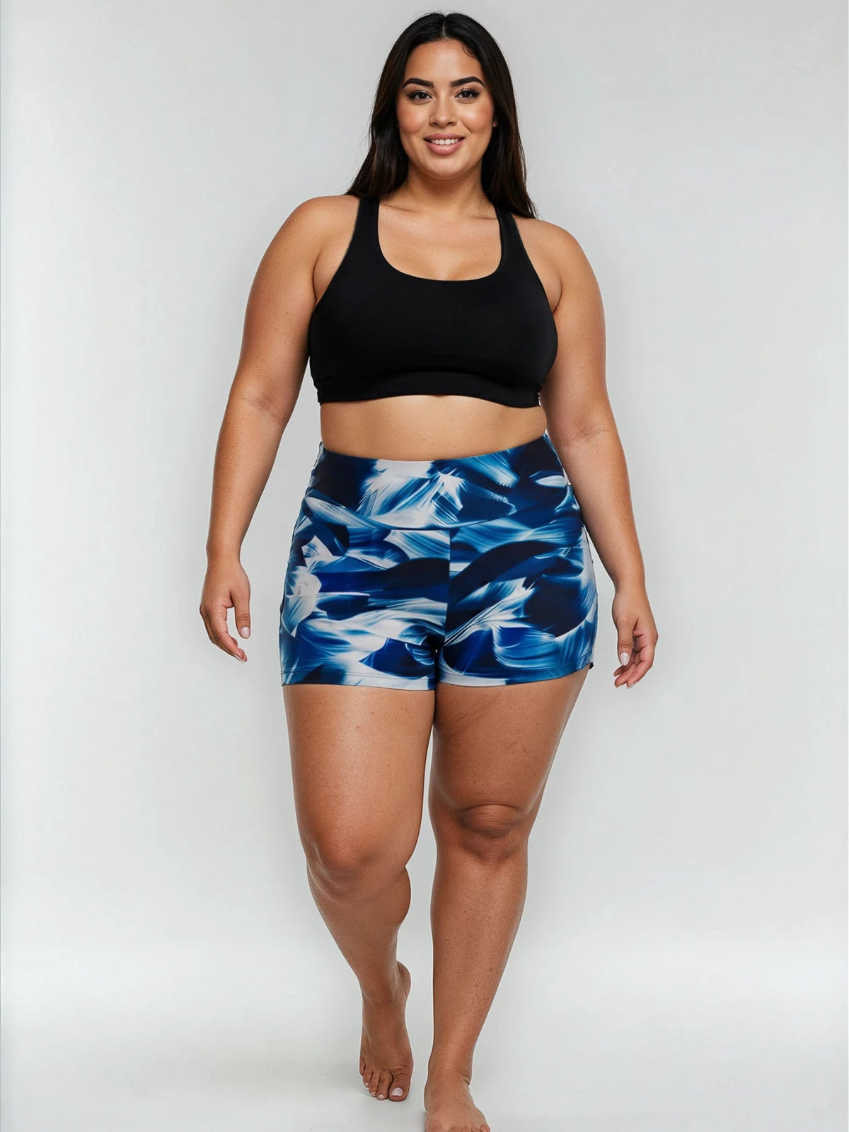 Swim Shorts | Plus Size in a blue abstract print with a comfortable fit on a plus size model. Size inclusive swimwear designed for every body.