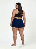 Swim Shorts | Plus Size in navy shown from the back on a curvy model with a comfortable fit for size-inclusive modest swimwear designed for every body