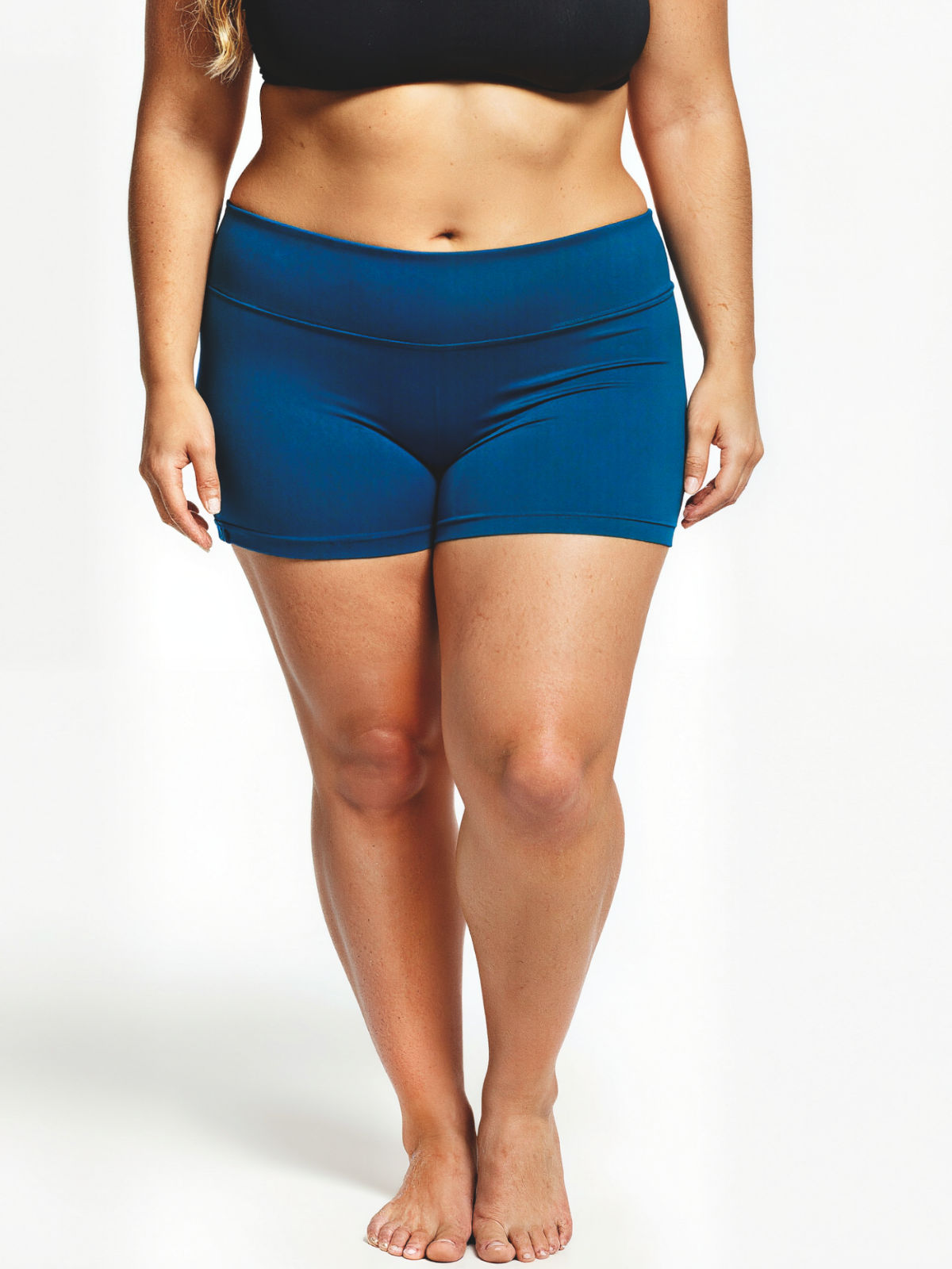 Model wearing Swim Shorts | Plus Size in blue with a wide supportive waistband and comfortable fit. Size-inclusive supportive swimwear designed for every body