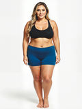 Swim Shorts | Plus Size in blue worn by a curvy model with a black swim top for modest size inclusive swimwear designed for every body