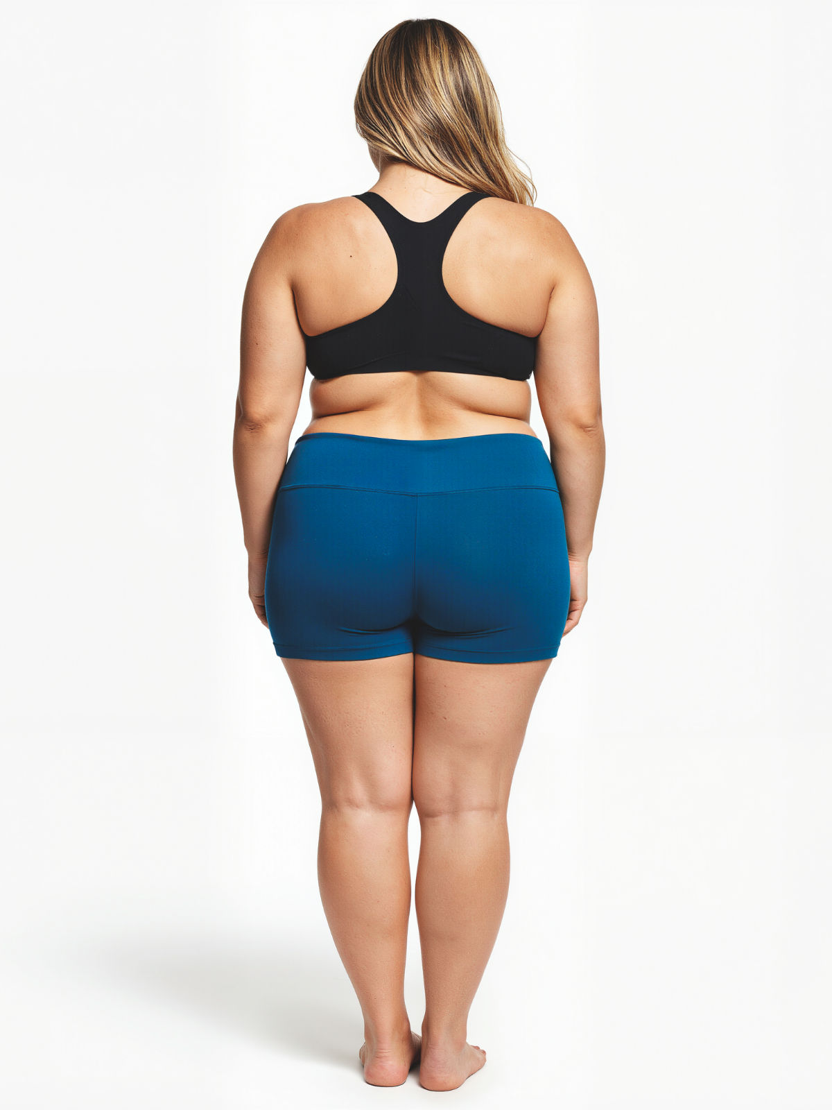 Swim Shorts | Plus Size in blue shown from the back on a model with a black swim top for modest comfortable swimwear designed for every body