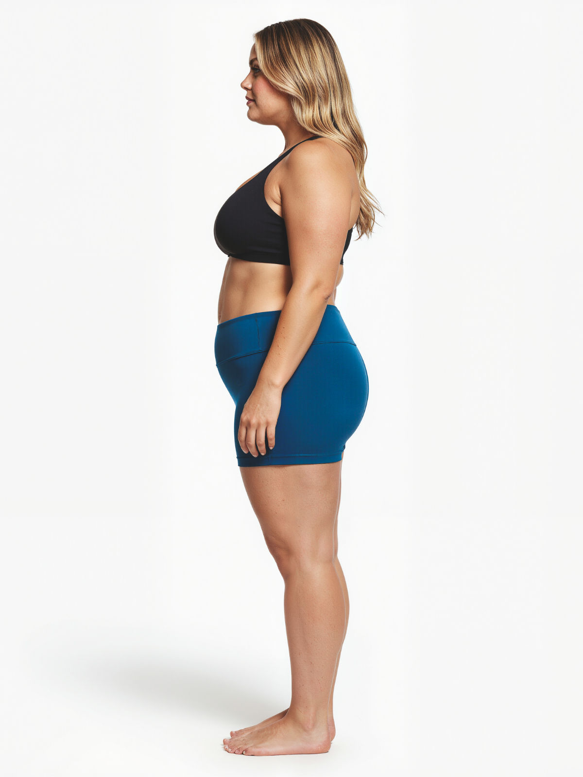 Blue Swim Shorts | Plus Size shown on a curvy model in side profile with a high waist and comfortable fit. Modest size-inclusive swimwear designed for every body.