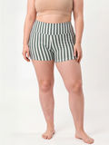 Swim Shorts | Plus Size in green and white stripes modeled as modest size inclusive swimwear with a comfortable fit designed for every body