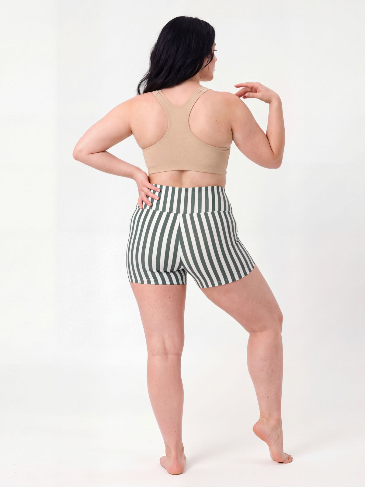 Swim Shorts | Plus Size in green and white vertical stripes modeled from the back with a comfortable fit for size inclusive and modest swimwear for every body