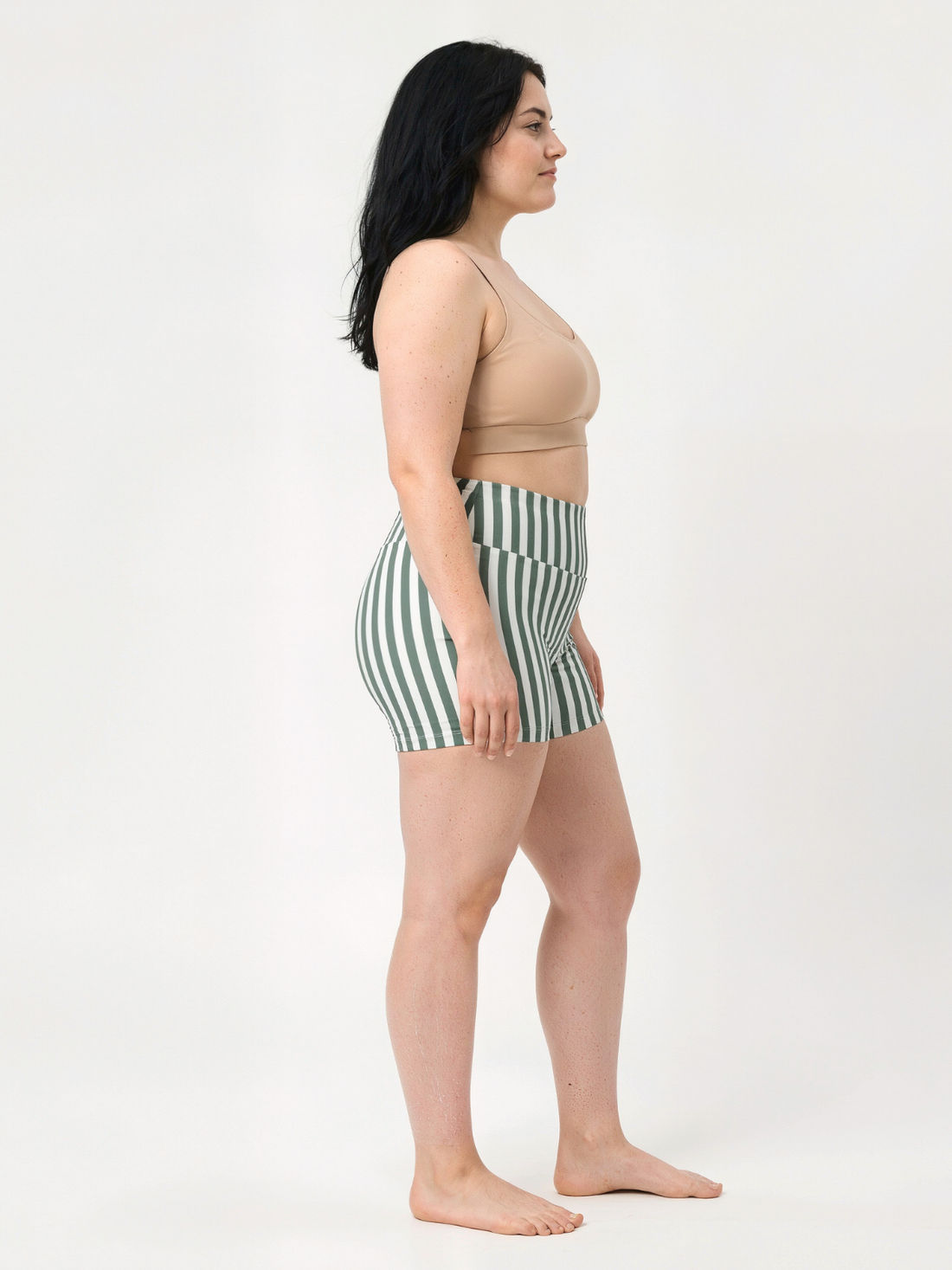 Swim Shorts | Plus Size modeled in side view with a high waisted green and white striped design for modest size-inclusive swimwear and a comfortable fit.