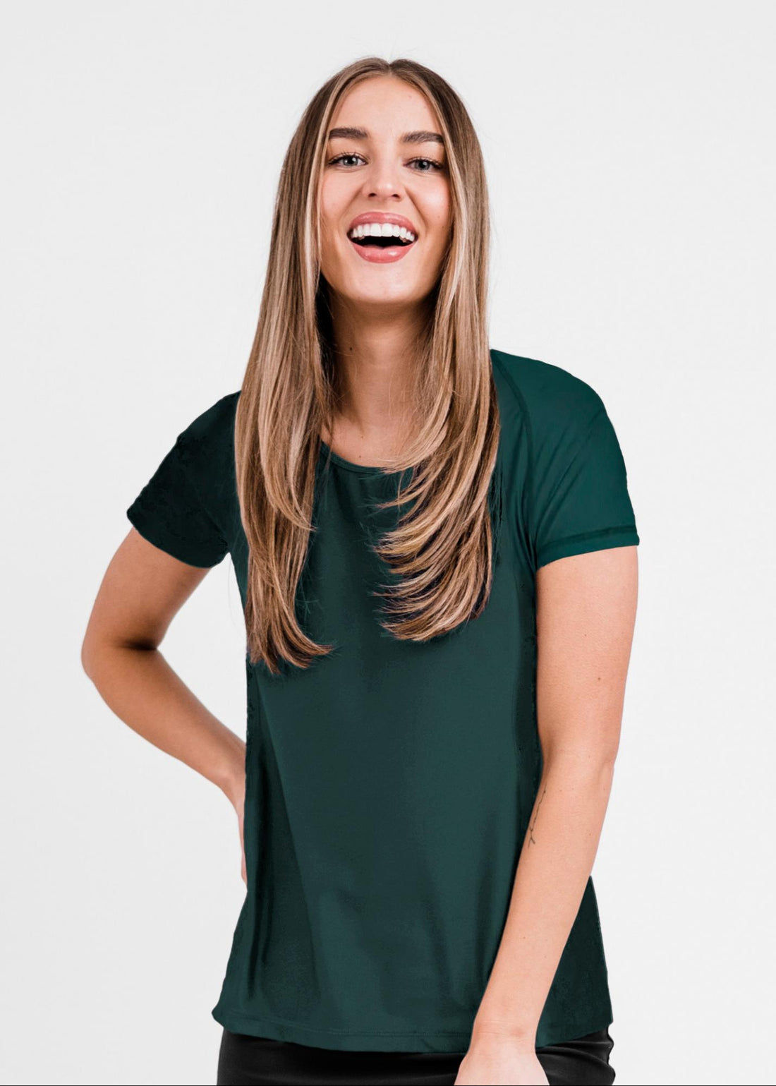 Woman wearing a navy and light blue athletic outfit on a plain background