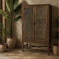 Chocolate Wood Eldridge solid mango wood tall cupboard with honey brown finish, featuring a wall-mounted cabinet with doors and natural wood grain.