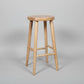 Natural oak stool with a solid top and legs, 65cm height, featuring a light natural finish and a sturdy, minimalist design.