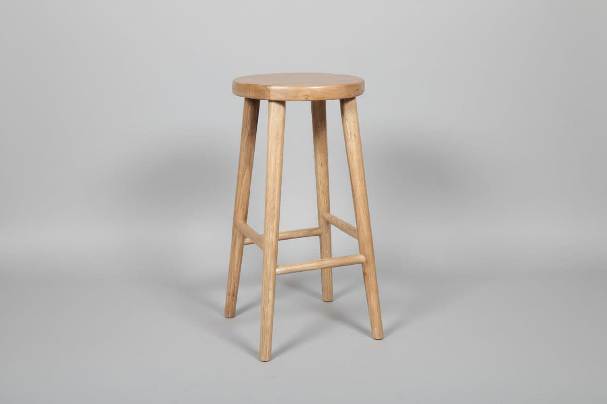 Natural oak stool with a solid top and legs, 65cm height, featuring a light natural finish and a sturdy, minimalist design.