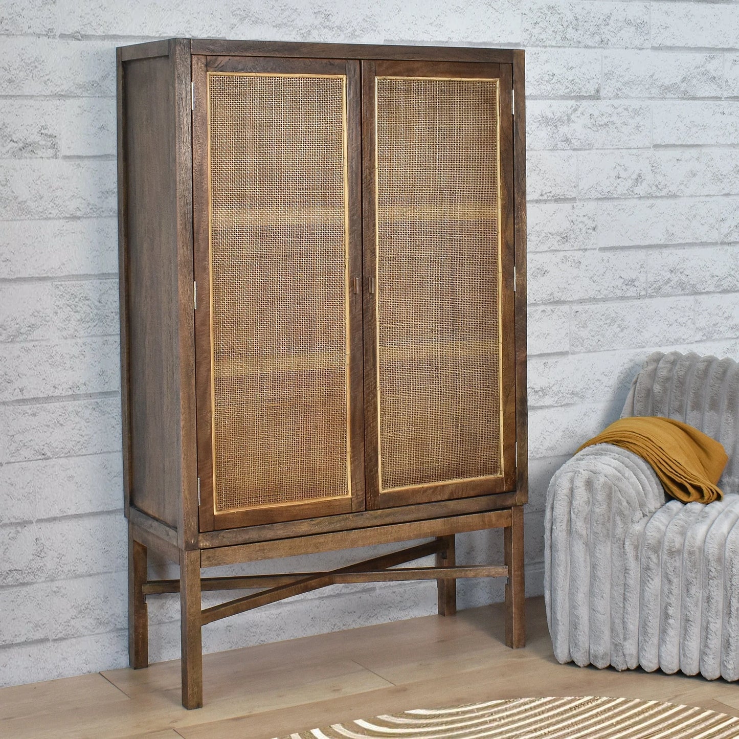 Solid mango wood tall cupboard cabinet in honey brown with wall-mounted design, featuring sleek handles and storage shelves.
