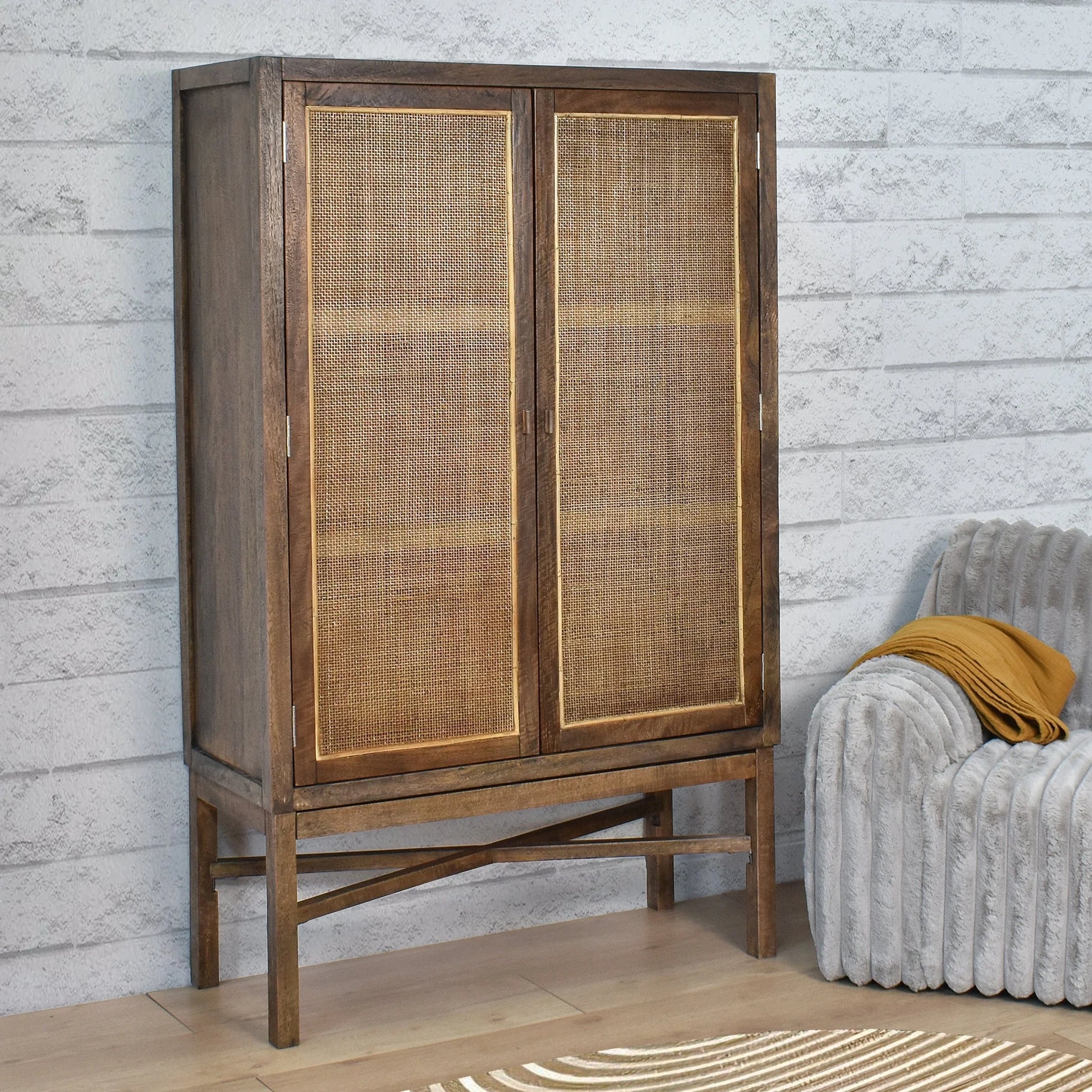 Solid mango wood tall cupboard cabinet in honey brown with wall-mounted design, featuring sleek handles and storage shelves.