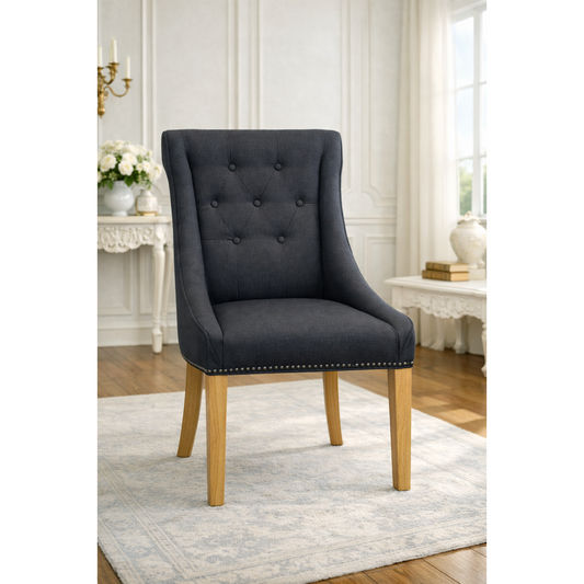 Black solid oak dining chair by MyChocolateWood featuring a sleek, modern design with a sturdy frame and comfortable seating.