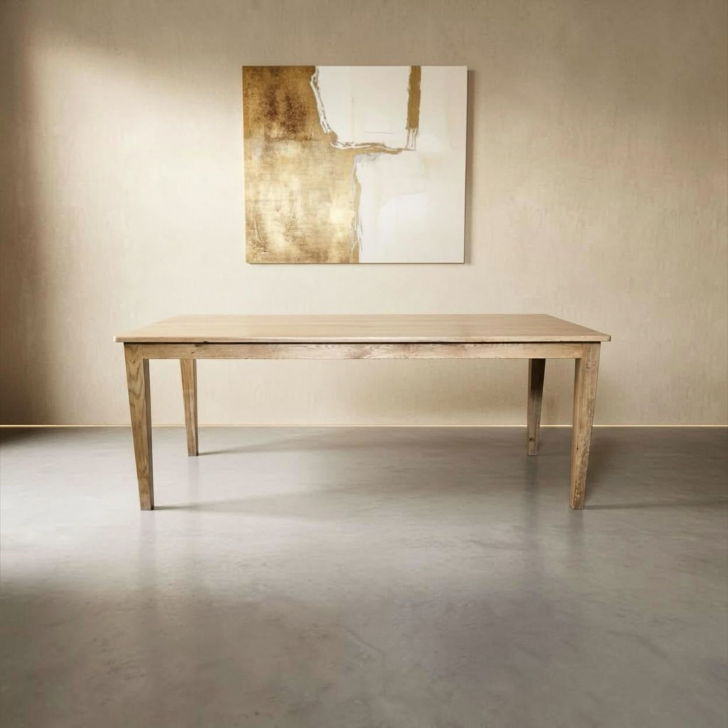 A light natural wood dining table with a rectangular top and four tapered legs, shown in a minimalist room setting with a concrete floor and a beige wall featuring abstract wall art.
