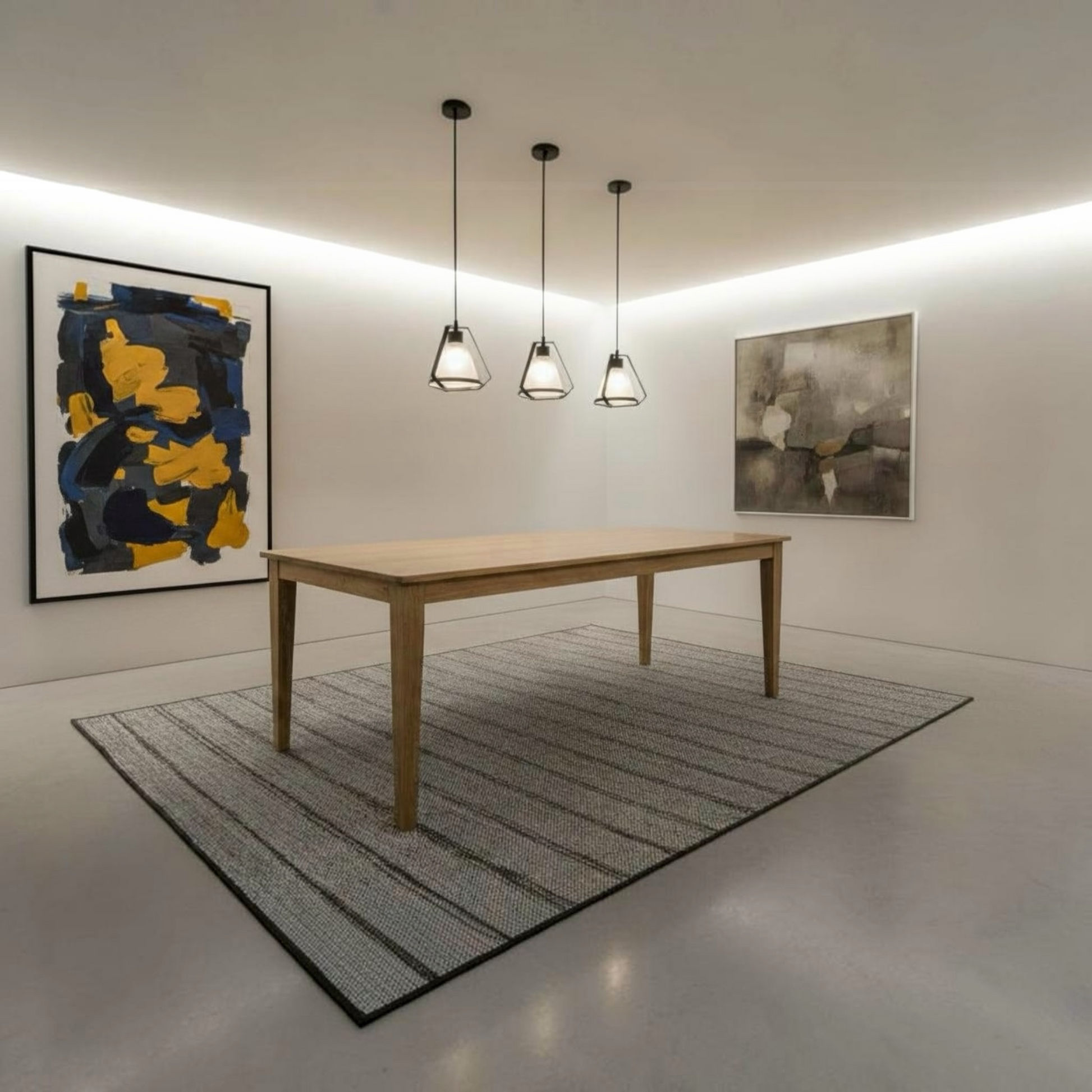 A modern dining room scene featuring a light oak rectangular table on a gray striped area rug, with three black pendant lights hanging above. The room has white walls, recessed lighting, and two framed abstract paintings.