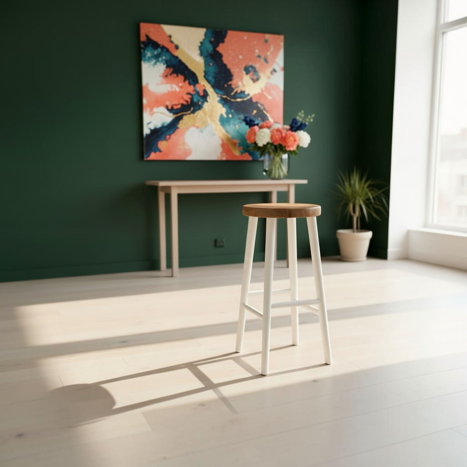 A modern bar stool with a light wood seat and white legs stands in a bright, minimalist room with a dark green wall, a console table, and a colorful abstract painting.