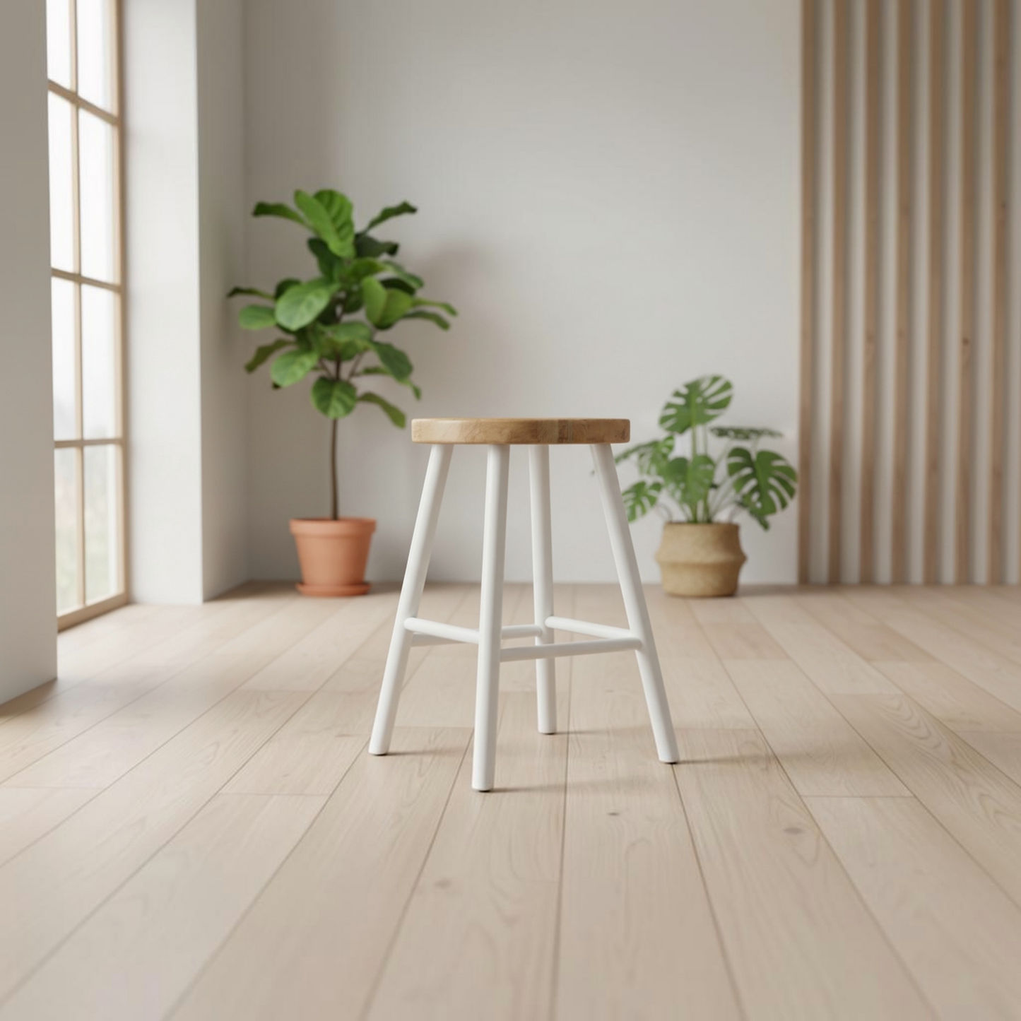 A modern white bar stool with a light natural wood seat and backrest, set on a light wood plank floor in a bright, minimalist room with potted plants.