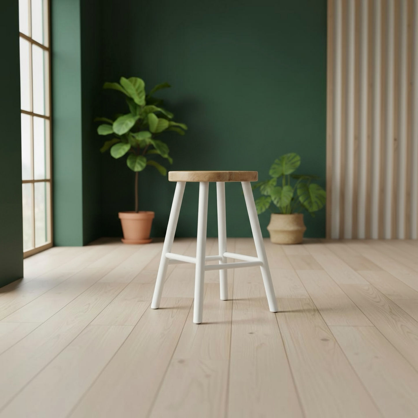 A modern bar stool with a light natural wood seat and white legs, positioned in a minimalist room with a dark green accent wall, light wood flooring, and potted plants.