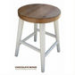 A rustic bar stool with a round chocolate wood seat and four distressed white legs, shown against a plain white background with a text overlay at the bottom.