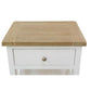 A small white nightstand or end table with a light natural wood top, featuring a single drawer with a round metallic knob and an open shelf below, shown on a plain white background.