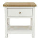 A small white nightstand with a light natural wood top, a single drawer with a round metallic knob, and an open lower shelf, shown on a plain white background.