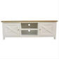 A white wooden TV stand or media console with a natural wood top, featuring two cabinet doors with X-brace panels on the sides and two open shelves in the center.