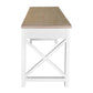 A white writing desk with a light natural wood top and a white X-shaped leg frame, shown from a front-facing perspective on a solid white background.