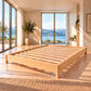 Melody Rounded Corners Bed in NZ Pine – slatted base in a bright bedroom with lake views