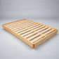 Malanya Bed with Curved Edges & Floating Legs in NZ Pine, Pale Yellow - Chocolate Wood
