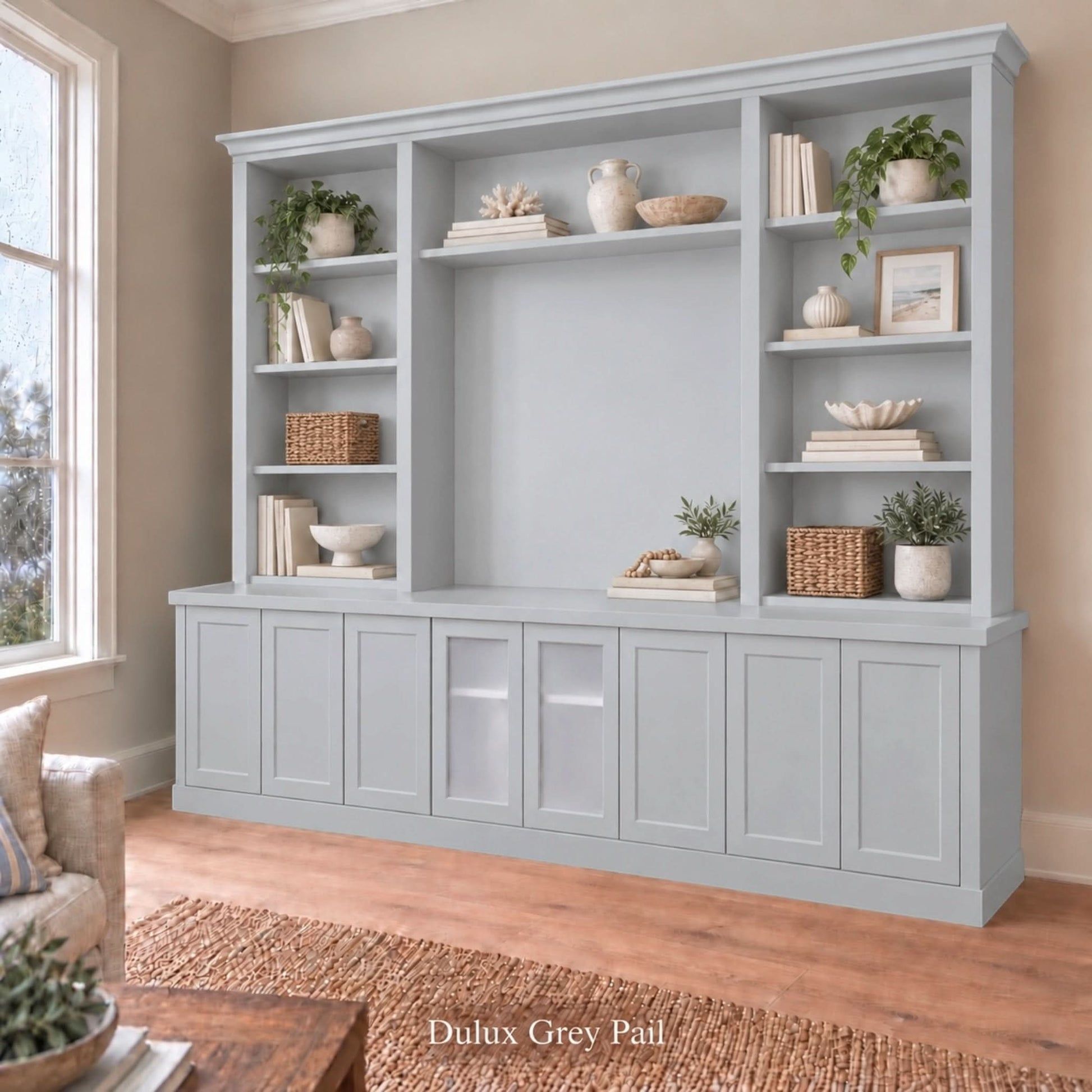 Harrington 5-piece wall unit in Dulux Grey Pail, styled with books, vases and plants, angled view with frosted glass centre doors