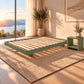 Malanya Bed with Curved Edges & Floating Legs in Sage, styled in a bedroom, bedside table not included - Chocolate Wood