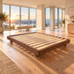 Malanya Bed with Curved Edges & Floating Legs in Walnut, angled view - Chocolate Wood