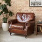 CHARLESTON AGED LEATHER ARMCHAIR IN ORIGINAL AGED LEATHER