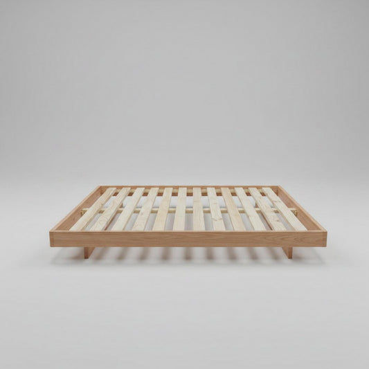 Solid Vic Ash bed by MyChocolateWood featuring curved edges and floating legs, finished with Danish oil, made to order.