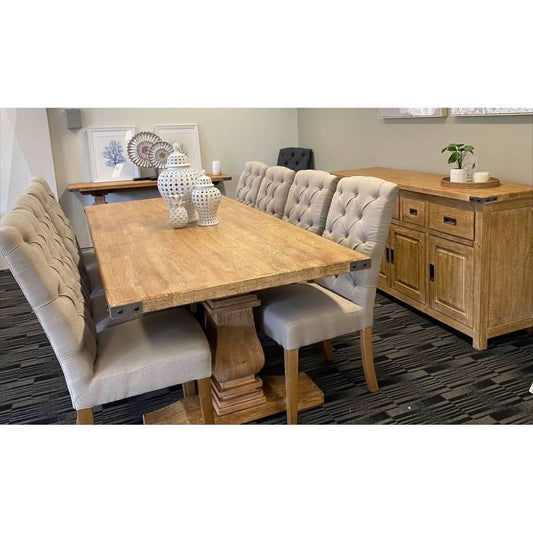 A honey wash ASTI rectangular pedestal dining table in natural wood finish, 230cm long, featuring a sturdy pedestal base.